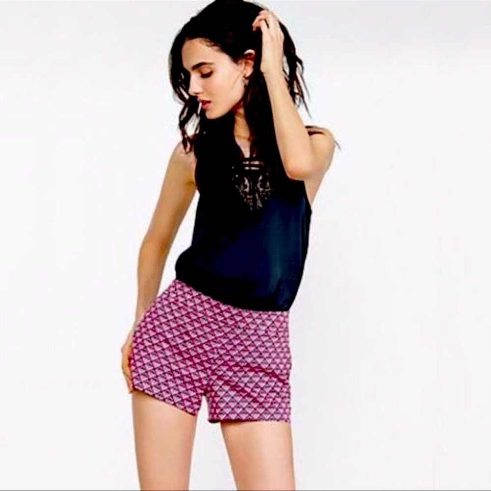 Express pink, black & white side zipper shorts.